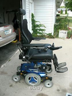 Permobile M300 Power Wheel Chair and Harmar Al500 Lift with Swing out Curbside