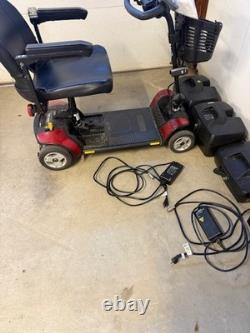 Scooter de voyage Go-Go Elite de Pride Mobility utilisé avec (2) batteries supplémentaires de 22 ah