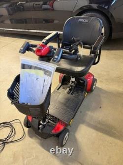 Scooter de voyage Go-Go Elite de Pride Mobility utilisé avec (2) batteries supplémentaires de 22 ah